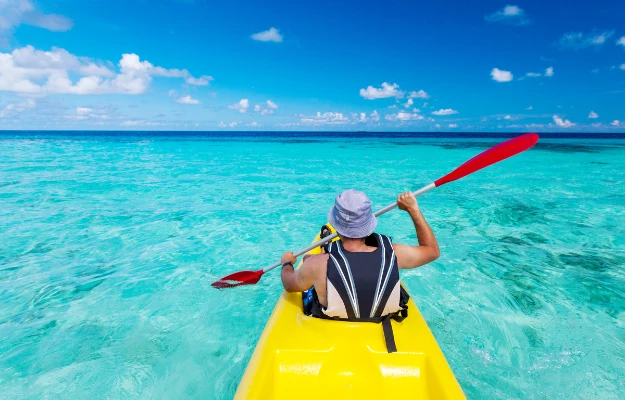 guy doing kayaking Paddle Like a Pro_ Essential Kayaking Tips You Need to Know Experience the Ultimate Kayaking Tour in Antigua body