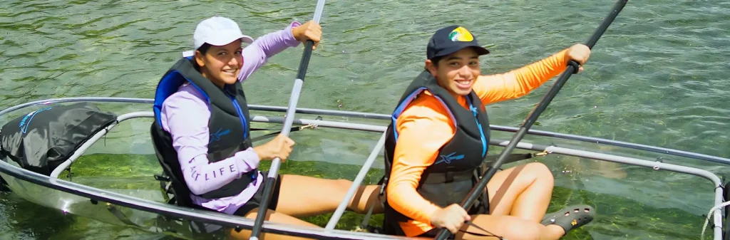 people kayaking on clear boat eco adventures rock adventures antigua image 1